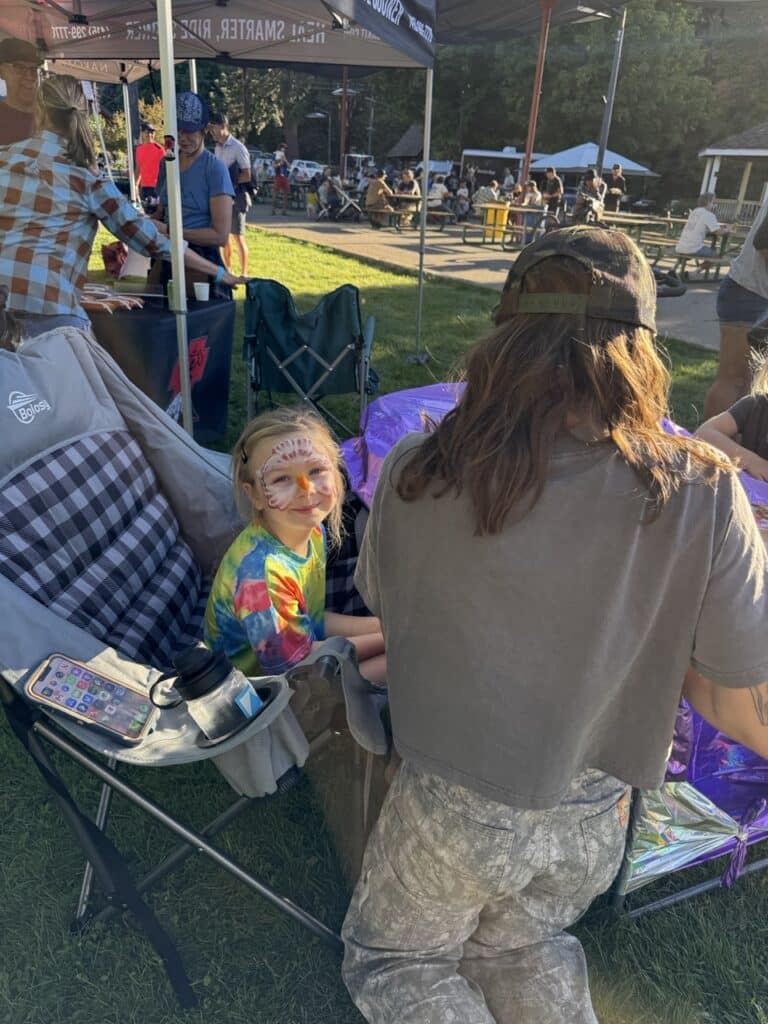 Sophie Allen doing an amazing job at face painting at the White Industries Booth